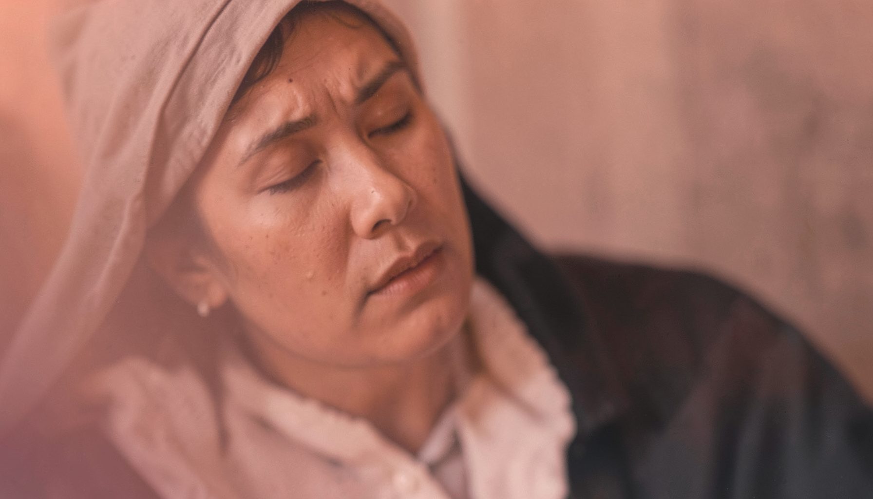 An intimate vocal album cover in warm rose and charcoal, suggesting heartfelt worship and reflection