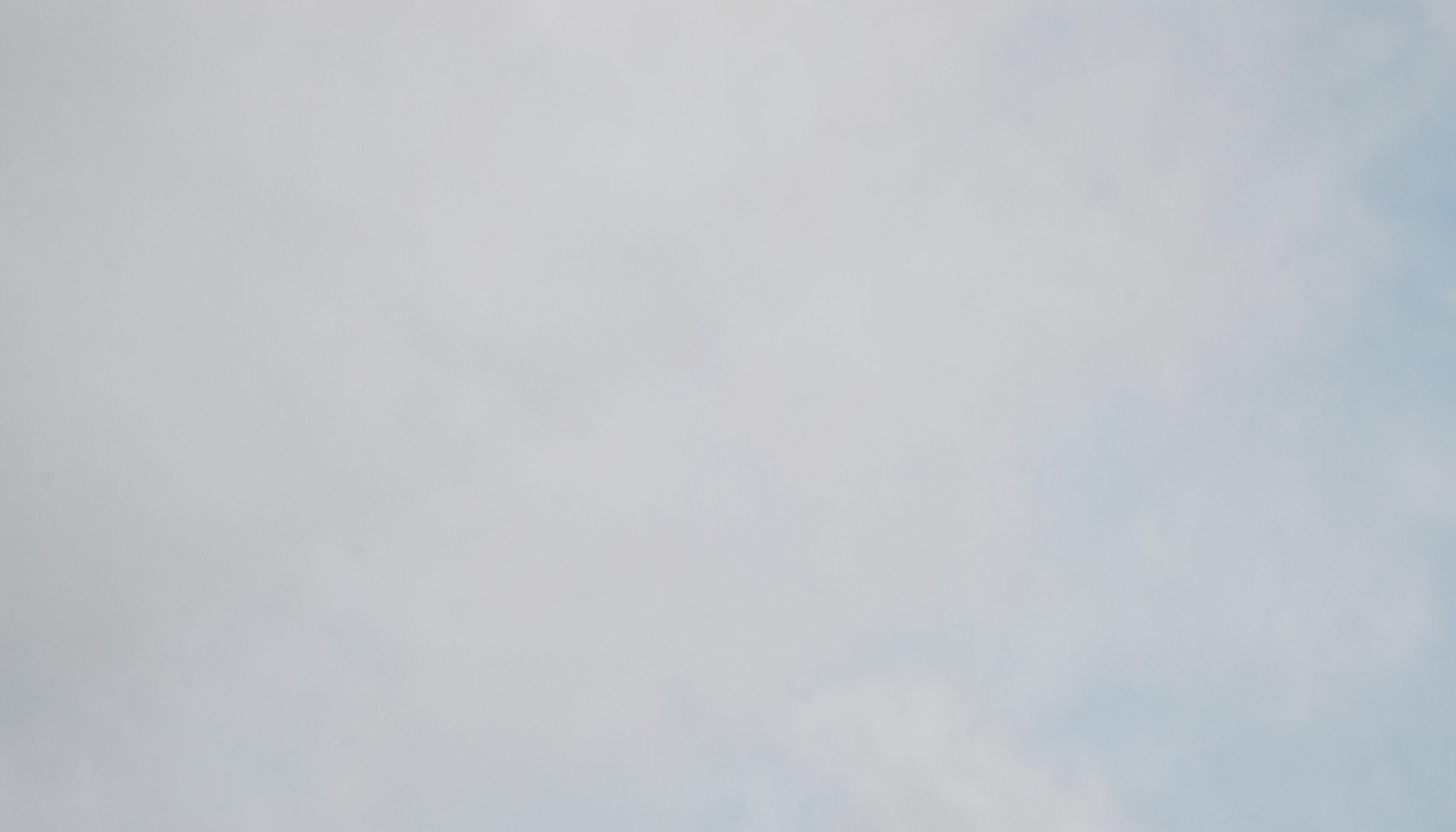 A simple, intimate single-track cover in soft dove grey and pale blue, suggesting a reflective solo performance